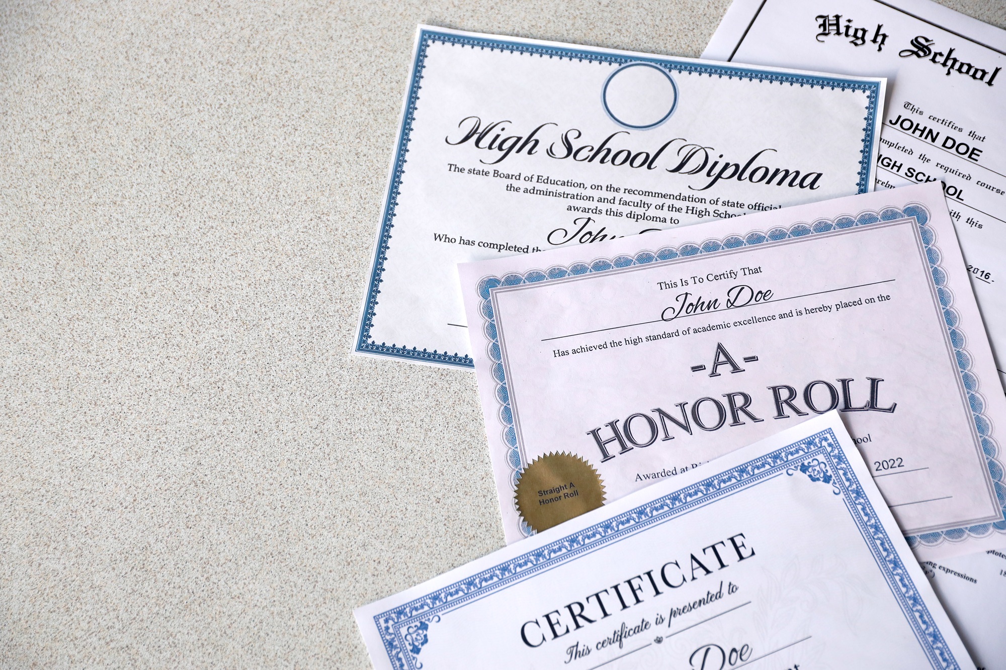 A honor roll recognition, certificate of achievement and high school diploma
