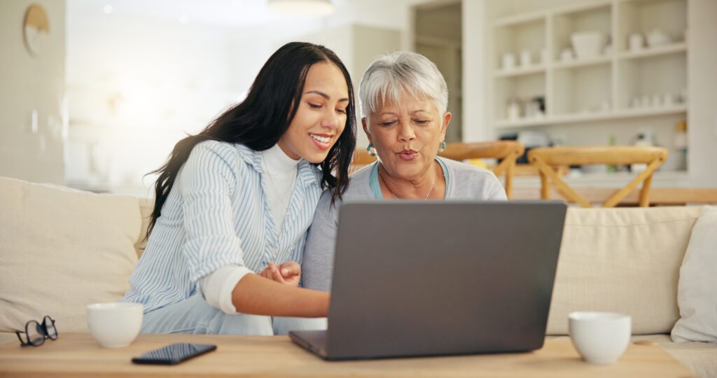Woman, senior mom and laptop with teaching, reading and typing for email notification, web or searc